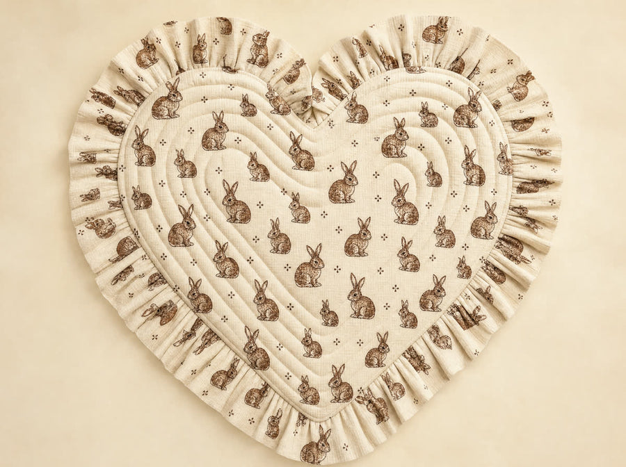 Little Bunny Heart Quilted Baby Mat styled flat-lay on ivory backdrop