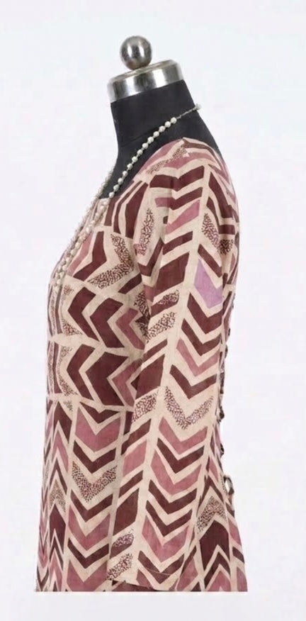 Close view of the rosewood chevron print and neckline binding