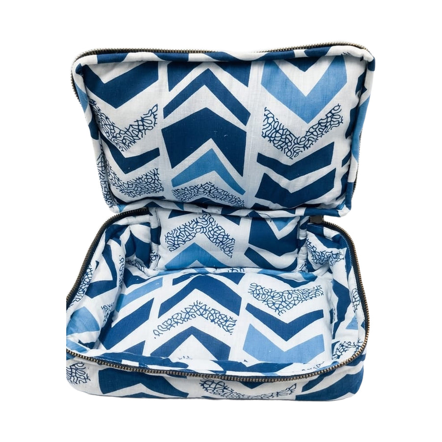 Interior of the Kabira travel pouch showing two lined zipped compartments